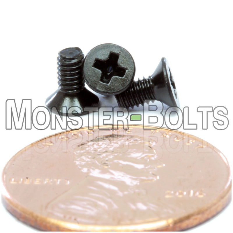 Black M2.5-0.45 x 5mm Phillips Flat Head machine screws with white background