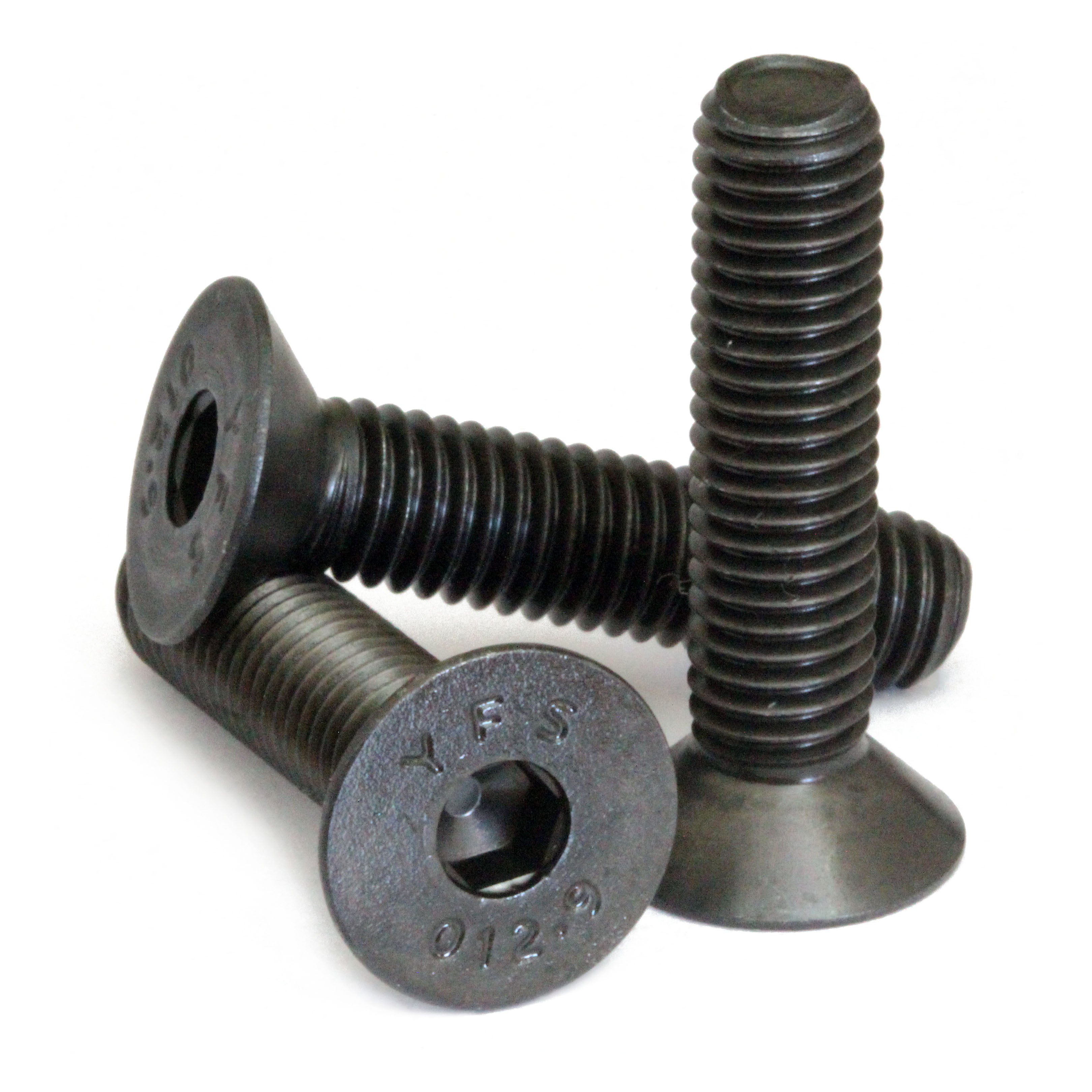 Countersunk Black SAE #10-24 Flat Head cap screws stacked to show different angles on white.