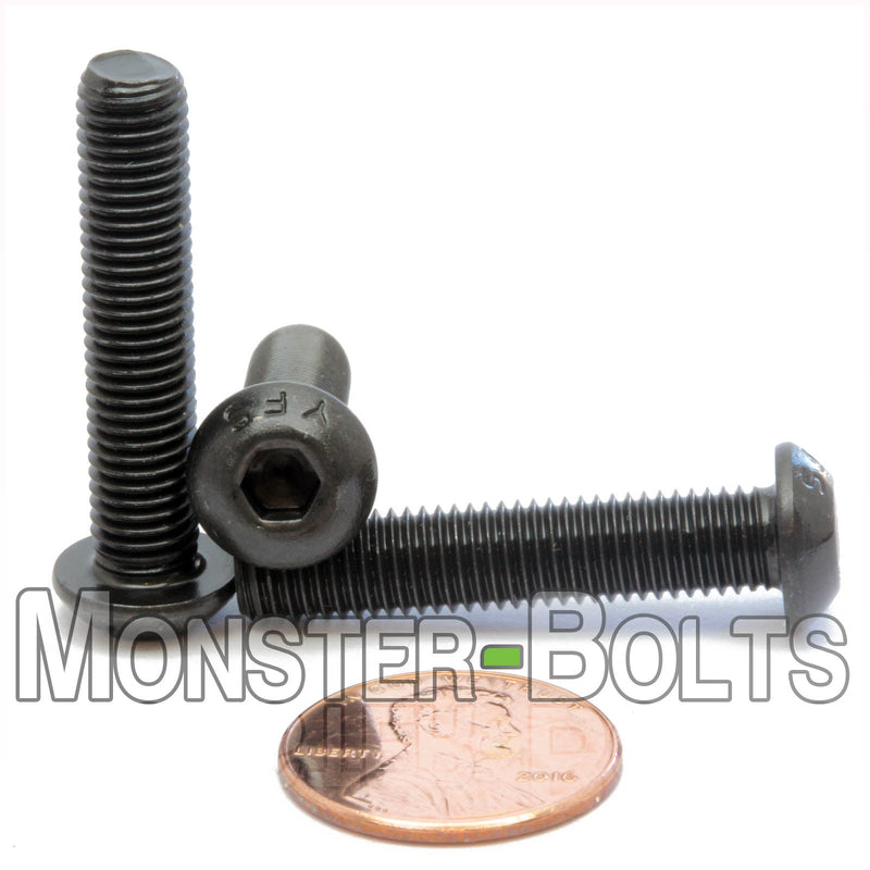 Black 1/4-28 x 1-1/4" button head socket cap screws, with US penny for size.