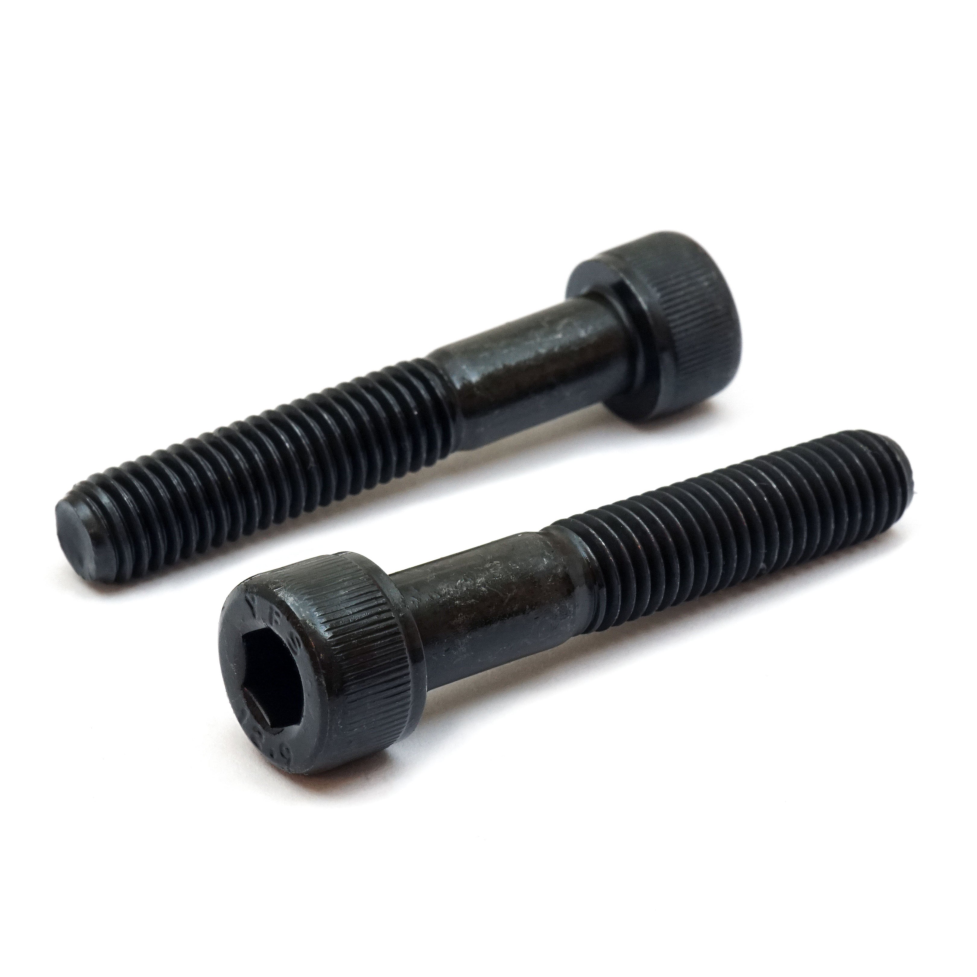 Black partial thread 7/16"-14 Socket Head cap screws on white background.