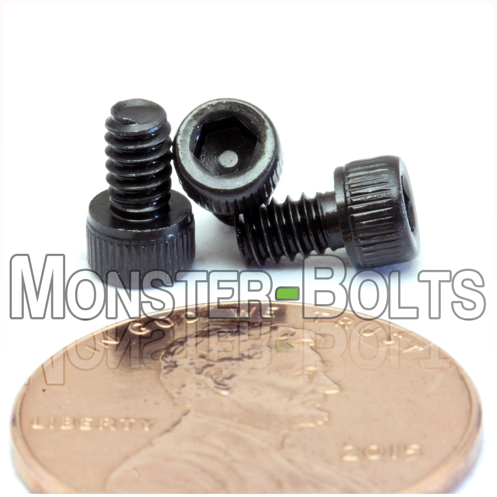 #4-40 x 3/16" Socket Head Cap screw, alloy steel with black oxide finish. Shown with US penny for screw size.