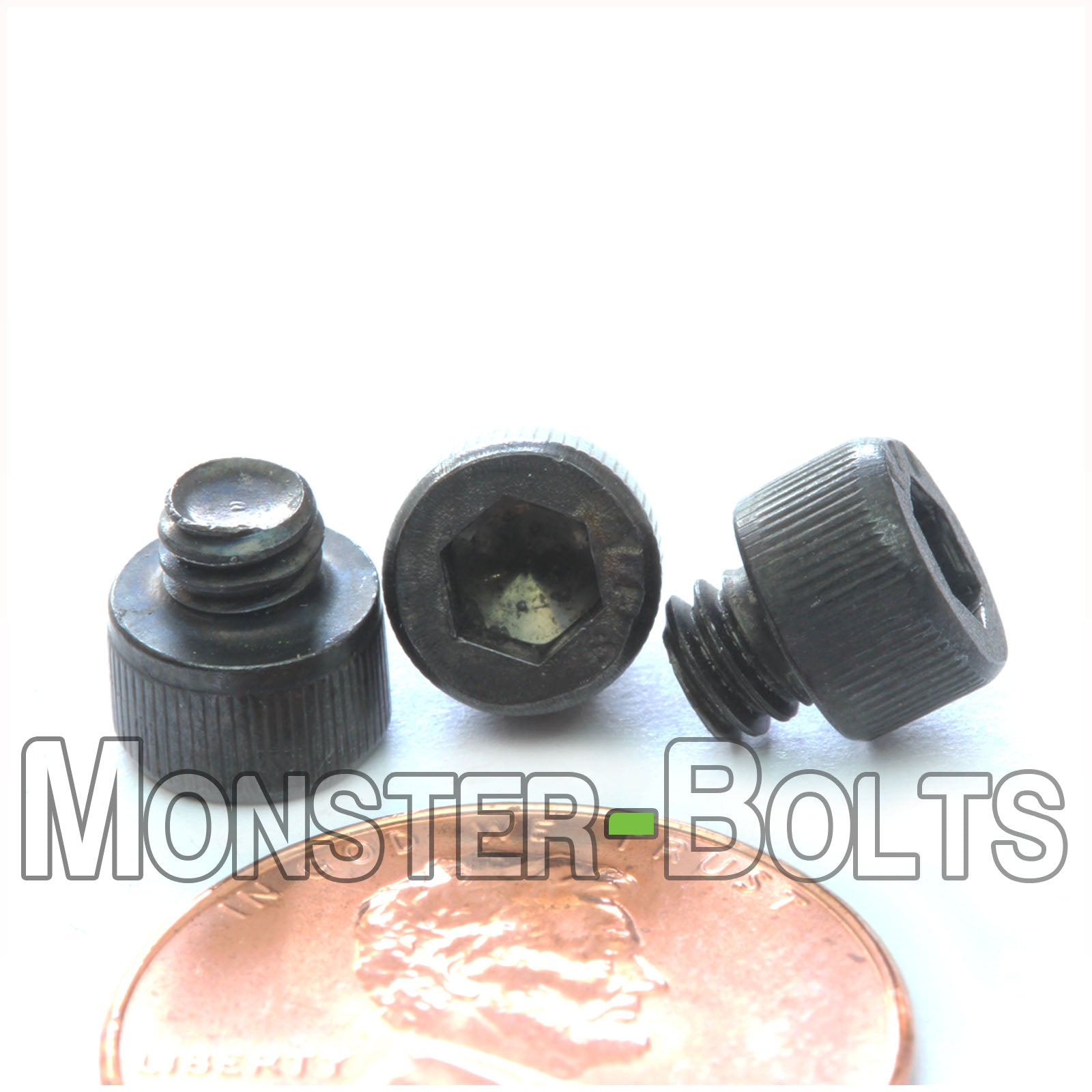 #8-32 x 1/8" Socket Cap screw, alloy steel with black oxide finish. Shown with US penny for scale.