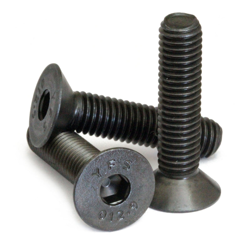 Countersunk Black SAE 1/4-20 Flat Head cap screws stacked to show different angles on white.