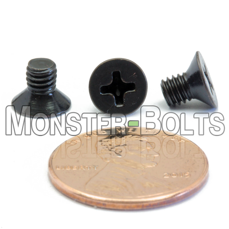 Black M4 x 6mm Phillips Flat Head machine screws with white background