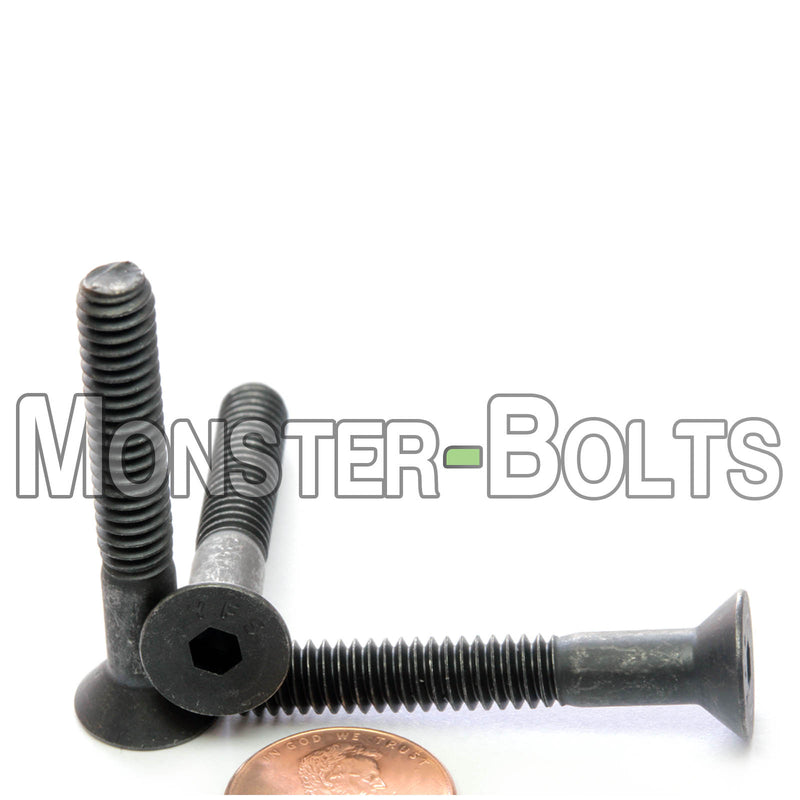 Black 1/4-28 x 1-3/4" socket flat head screws, with US penny for size comparison.