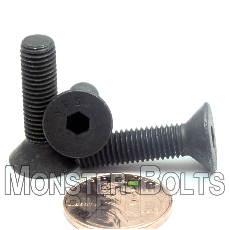 Black 1/4-28 x 1" flat head socket screws, with US penny for size.