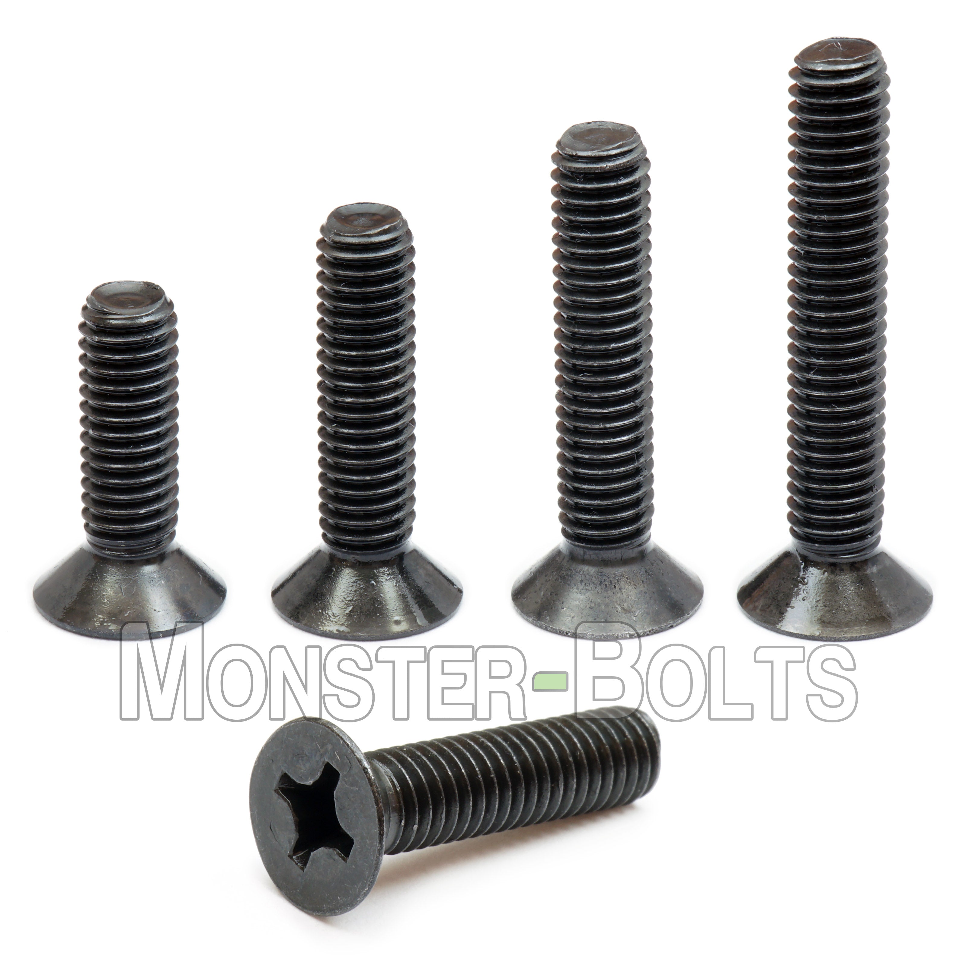 Black M2 Phillips flat head machine screws stacked to show different lengths with white background.