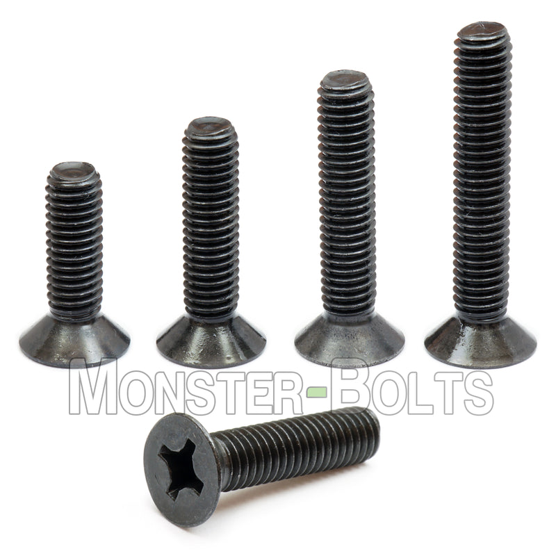 Black M4 Phillips flat head machine screws stacked to show different lengths with white background.