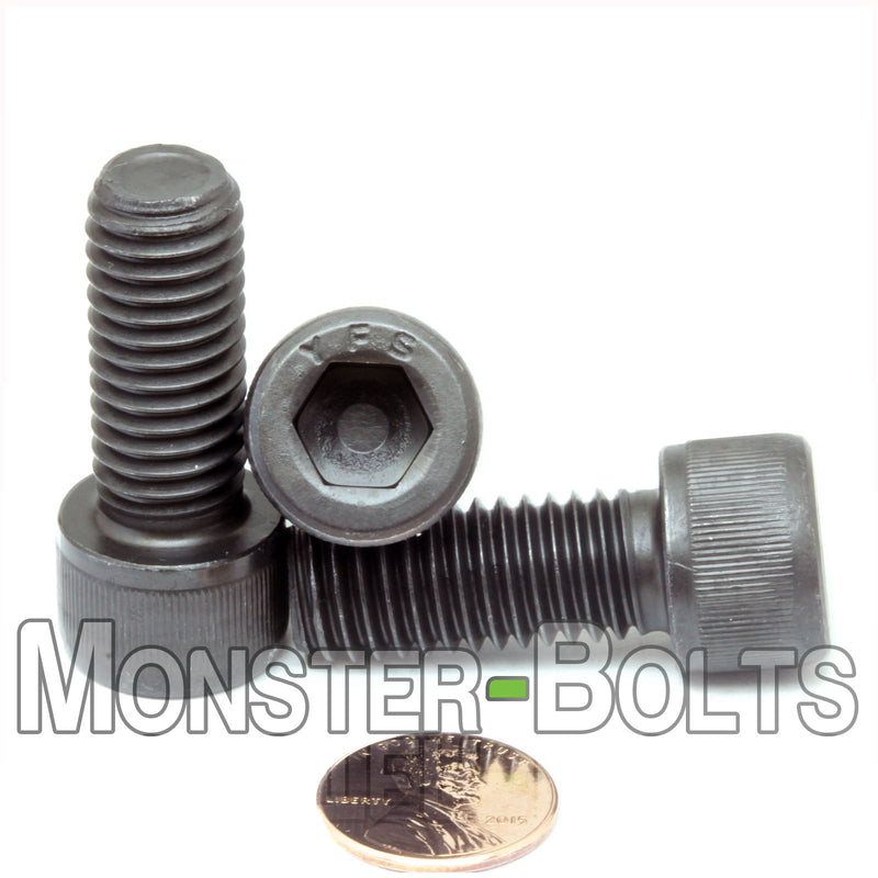 1/2"-13 x 1-1/4" Socket Head Cap screw, alloy steel with black oxide finish. Shown with US penny size comparison.