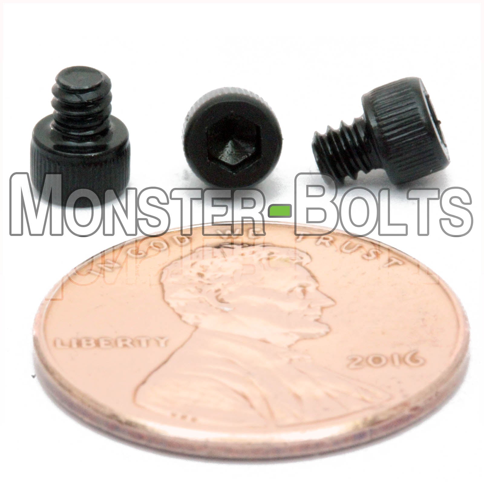 #4-40 x 1/8" Socket Head Cap screw, alloy steel with black oxide finish. Shown with US penny for screw size.