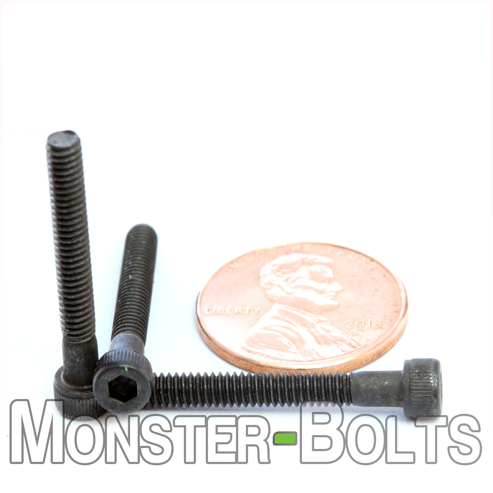 #5-40 x 1" Socket Head Cap screw, alloy steel with black oxide finish. Shown with US penny for screw size.