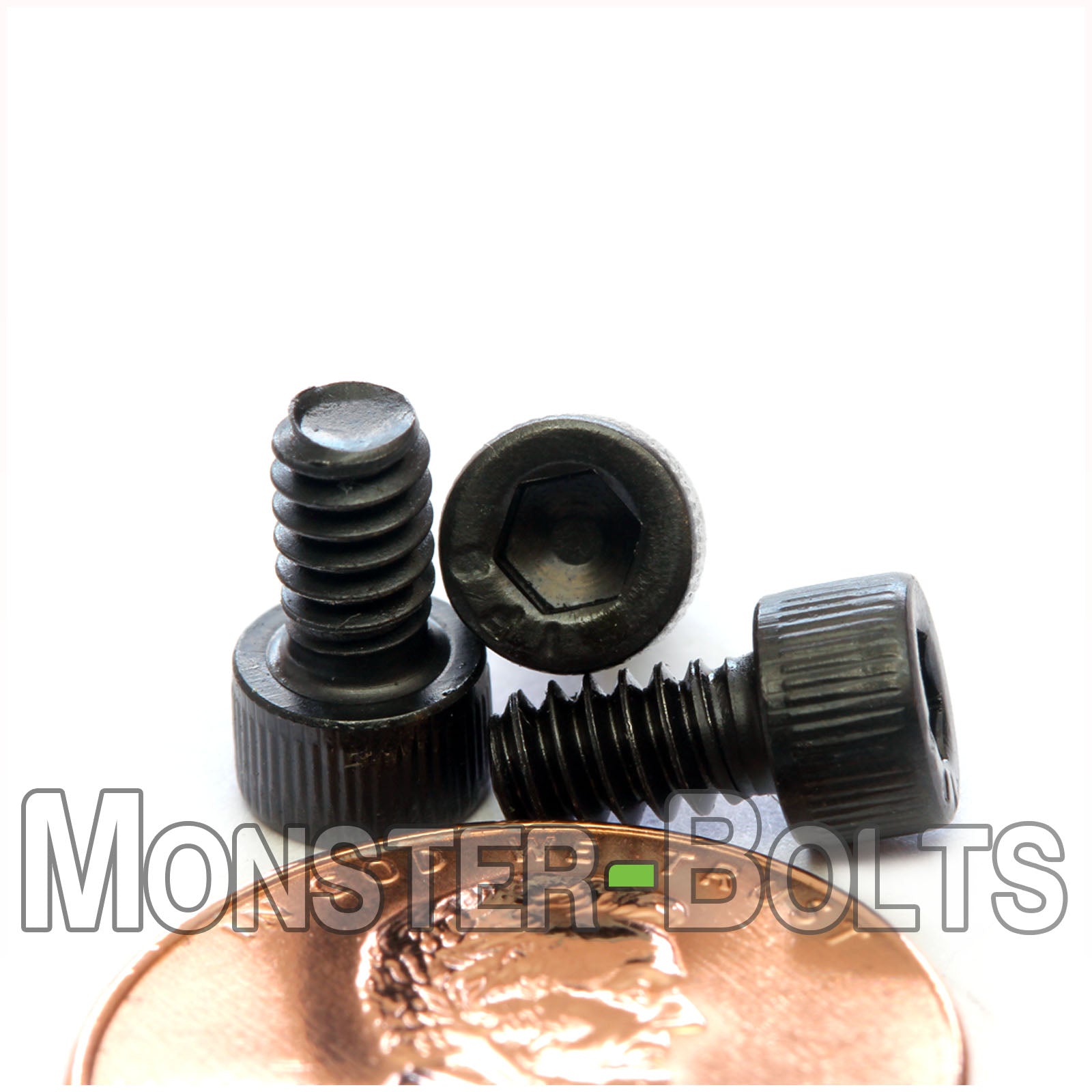 #6-32 x 1/4" Socket cap screw, alloy steel with black oxide finish. Shown with US penny for scale.