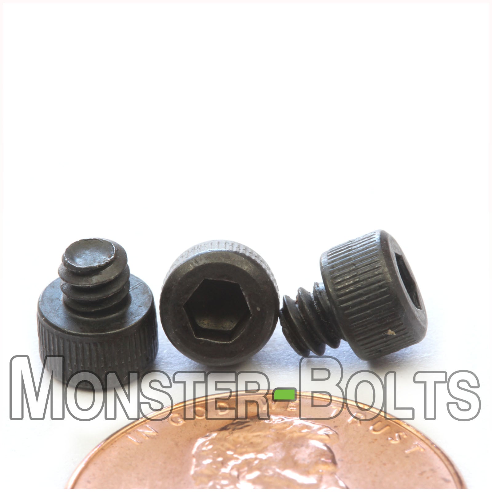 #6-32 x 1/8" Socket Cap screw, alloy steel with black oxide finish. Shown with US penny for screw size.