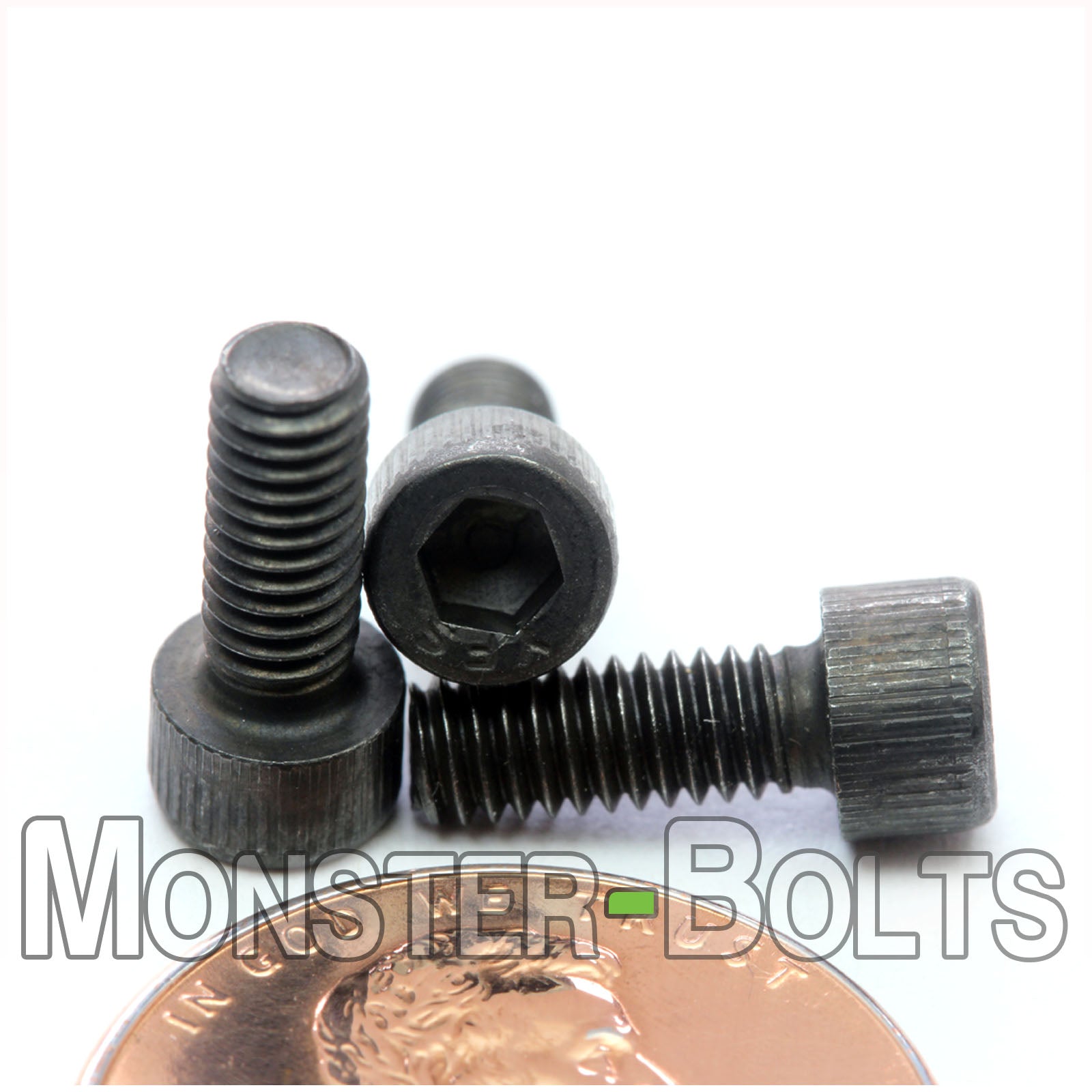 #6-40 x 3/8 inch Socket Head Cap screw, alloy steel with black oxide finish. Shown with US penny for screw size.